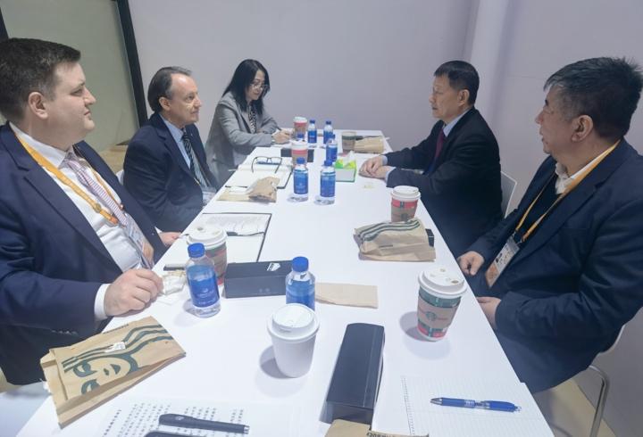 A group of people sitting at a tableDescription automatically generated